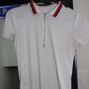 White shirt with red and black trim collar
